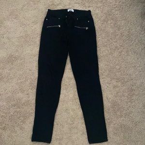 Black PAIGE skinny jeans with zipper pockets